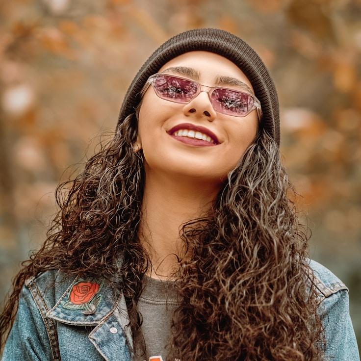 Amara Khan, Lead Design Curator at PebbleCoveHarbor, reviewing corporate floral arrangements